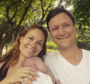 Gillian Turner, Alex Kramer, and their daughter, Lucia, make up a family picture