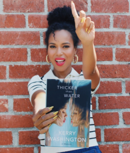 Kerry Washington holding her launch book.